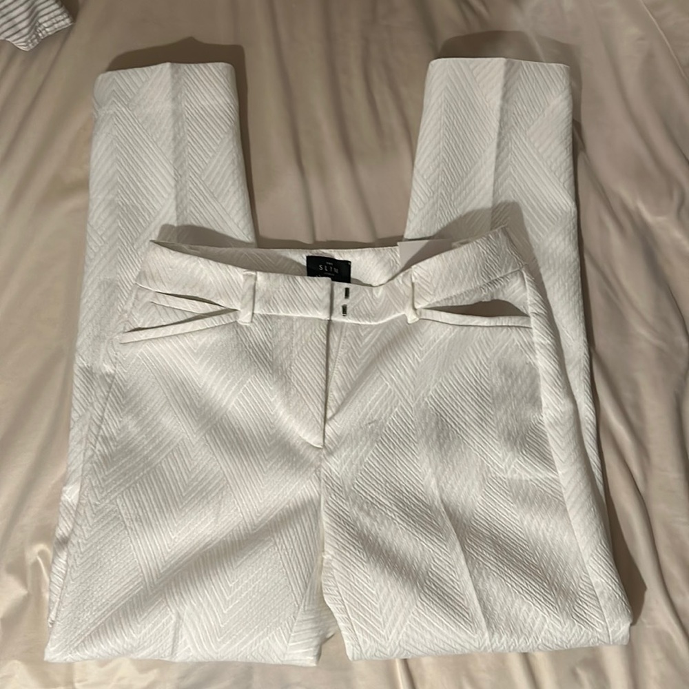 Brand new White House Black Market white slacks with neat design. NWT.